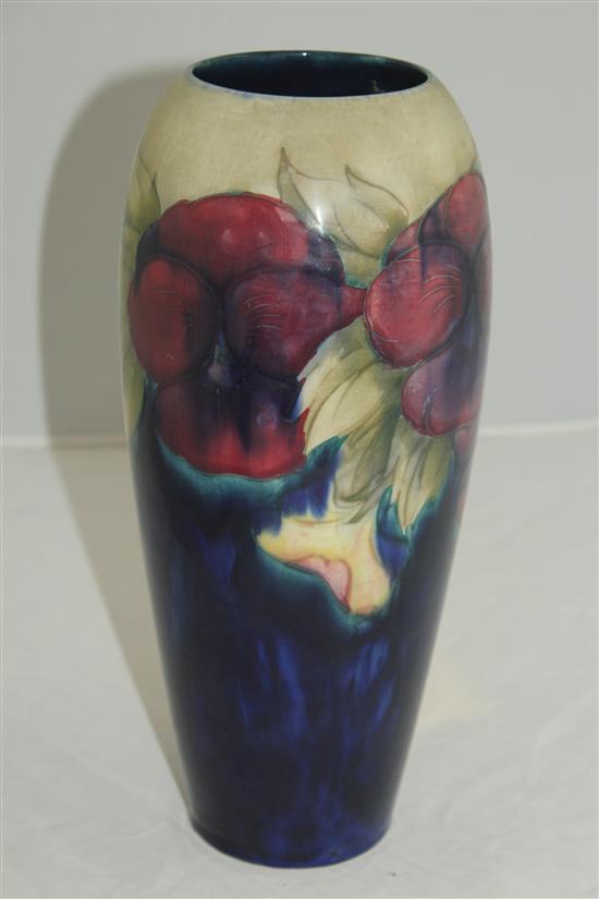 Two William Moorcroft pansy pattern vases, c.1917, 27cm, latter vase repaired